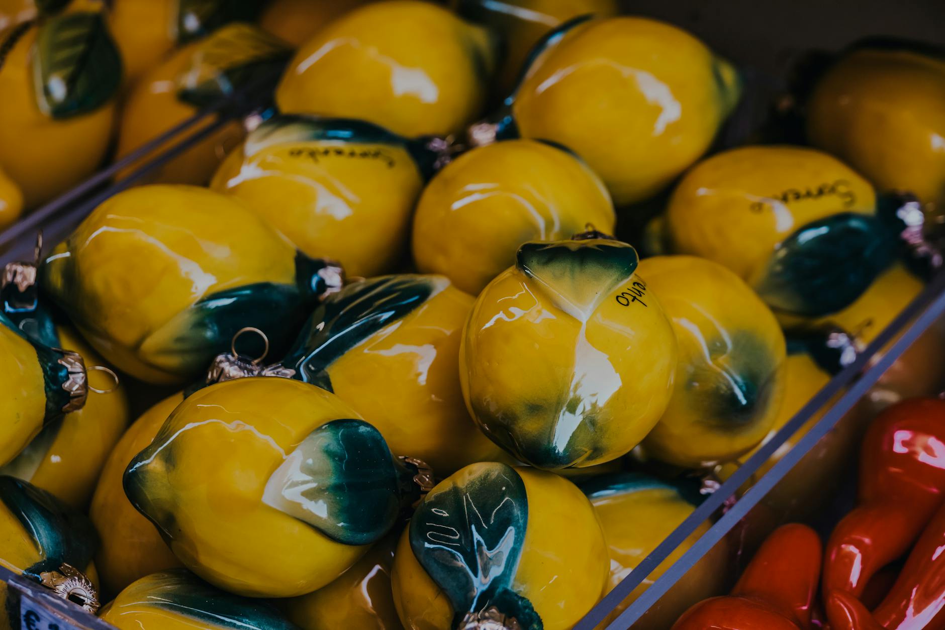 Vibrant yellow ceramic lemons artfully displayed, representing the playful and approachable design of lemon sexual toys