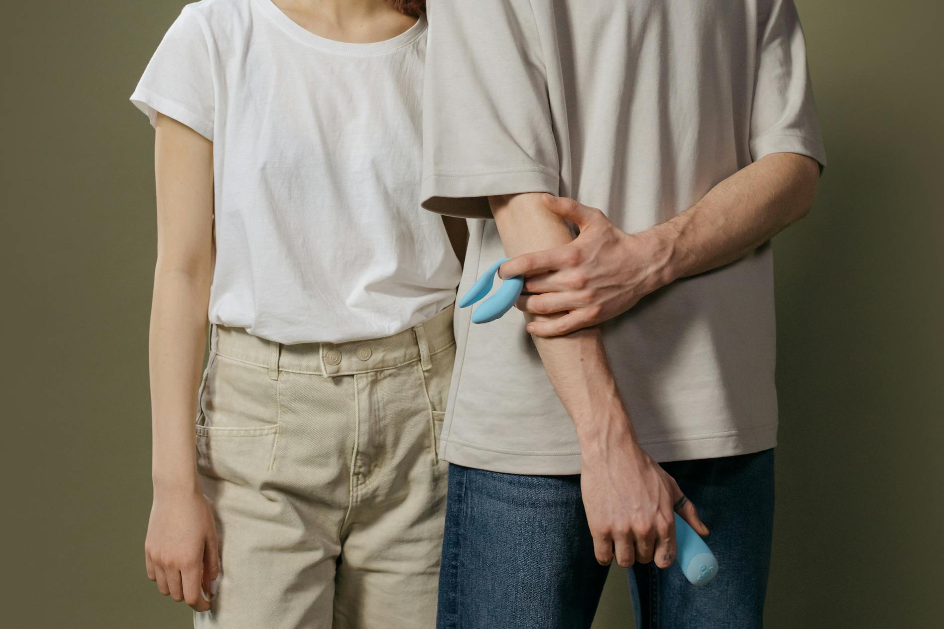 A couple exploring intimacy together with modern pleasure tools